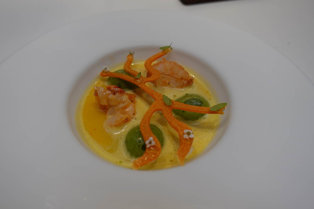 Potato and parsley gnocchi with seafood, bivalves and zucchini flower emulsion