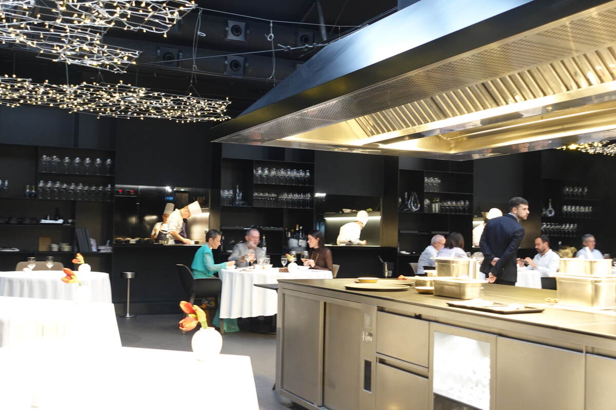 The dining room, with the kitchen at its center.